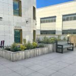 Image of the Allam Diabetes Centre roof newly refurbished by the WISHH charity. Furbished with chairs, tables and flowers for staff and patients to enjoy.